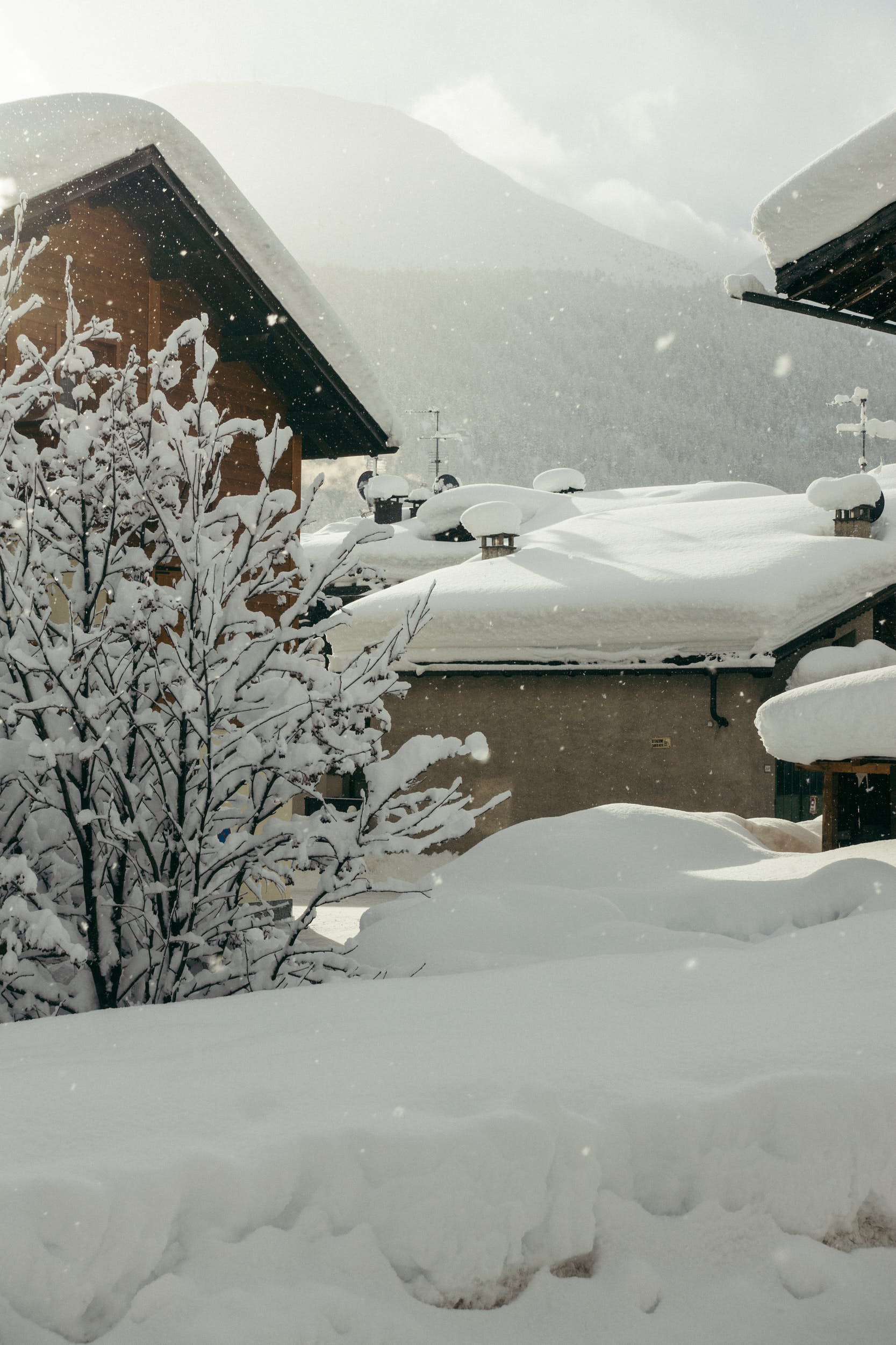 Beautiful travel photography of a mountain village with a lot of snow.