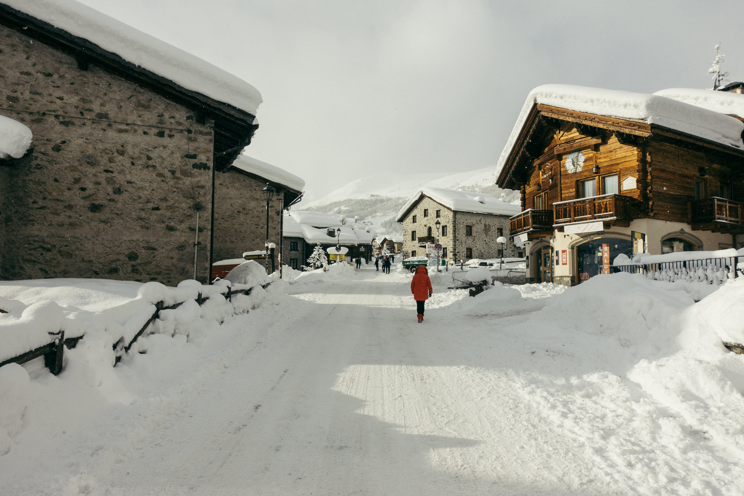 Mountain village covered in snow in beautiful morning light.