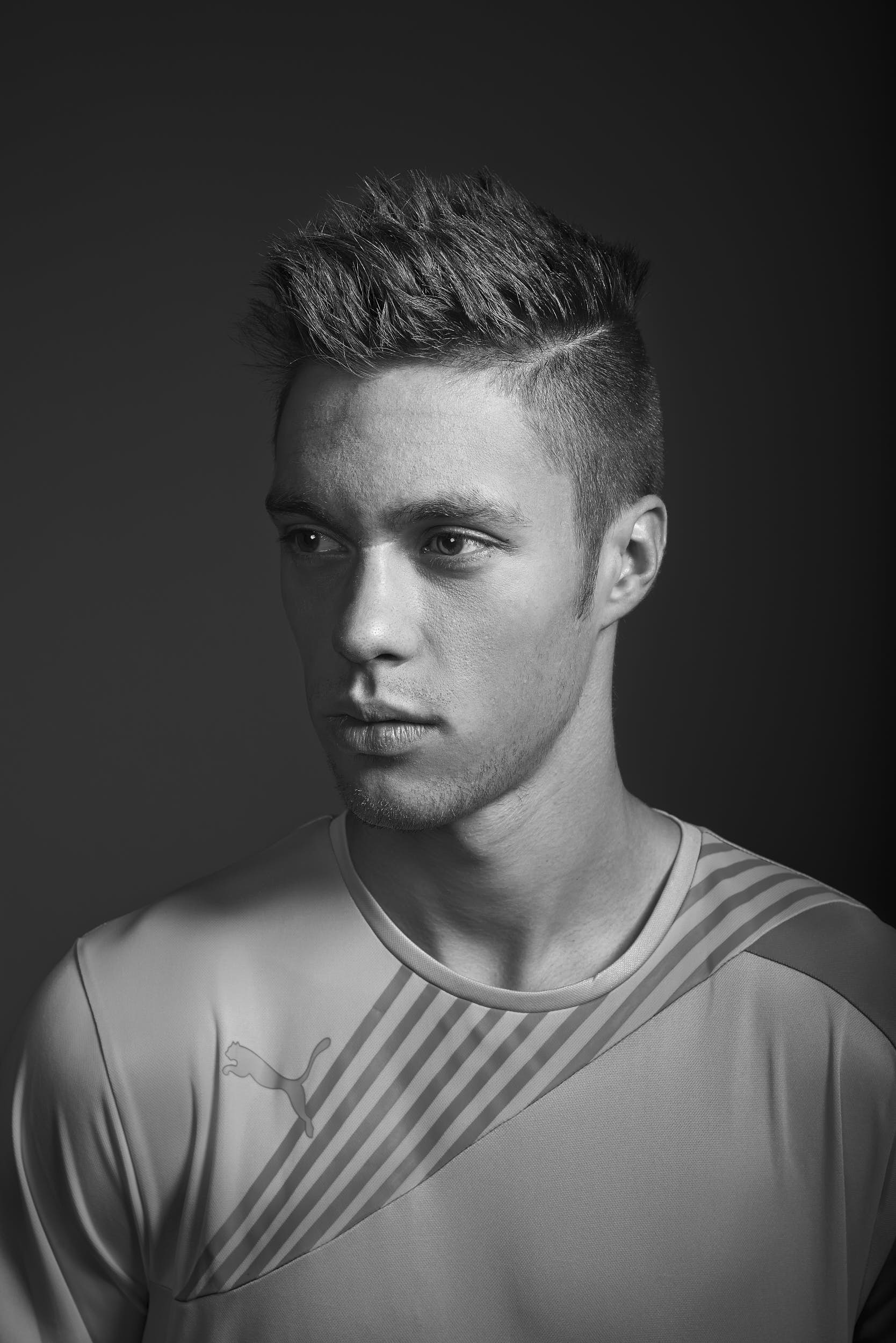 Black and white portrait of a football player.