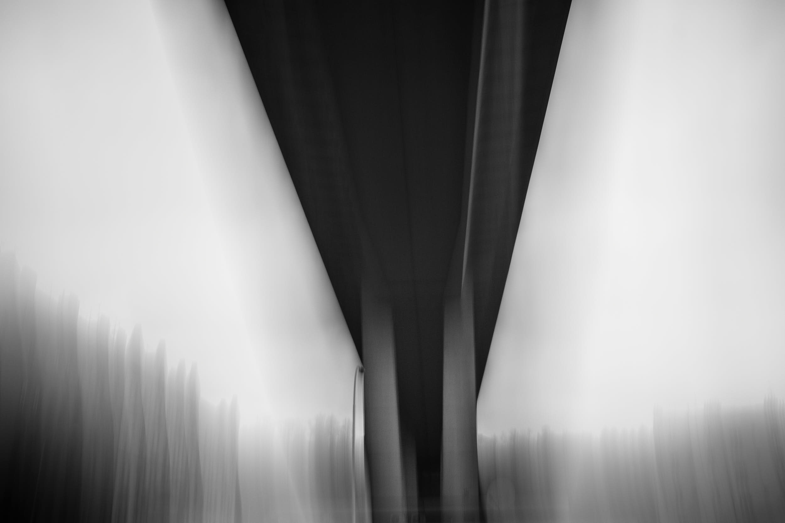 Abstract black and white photography of a bridge with motion blur.