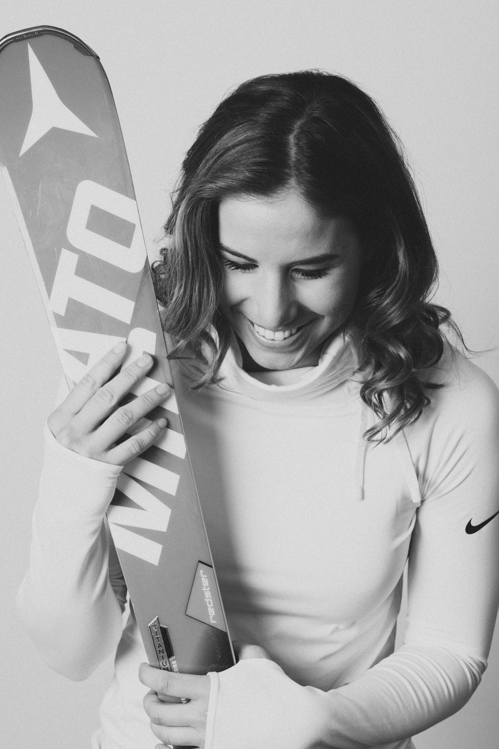 Olympic gold medailist Ester Ledecká laughing in a studio portrait.